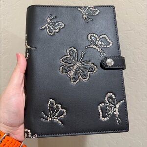Coach notebook with butterfly print